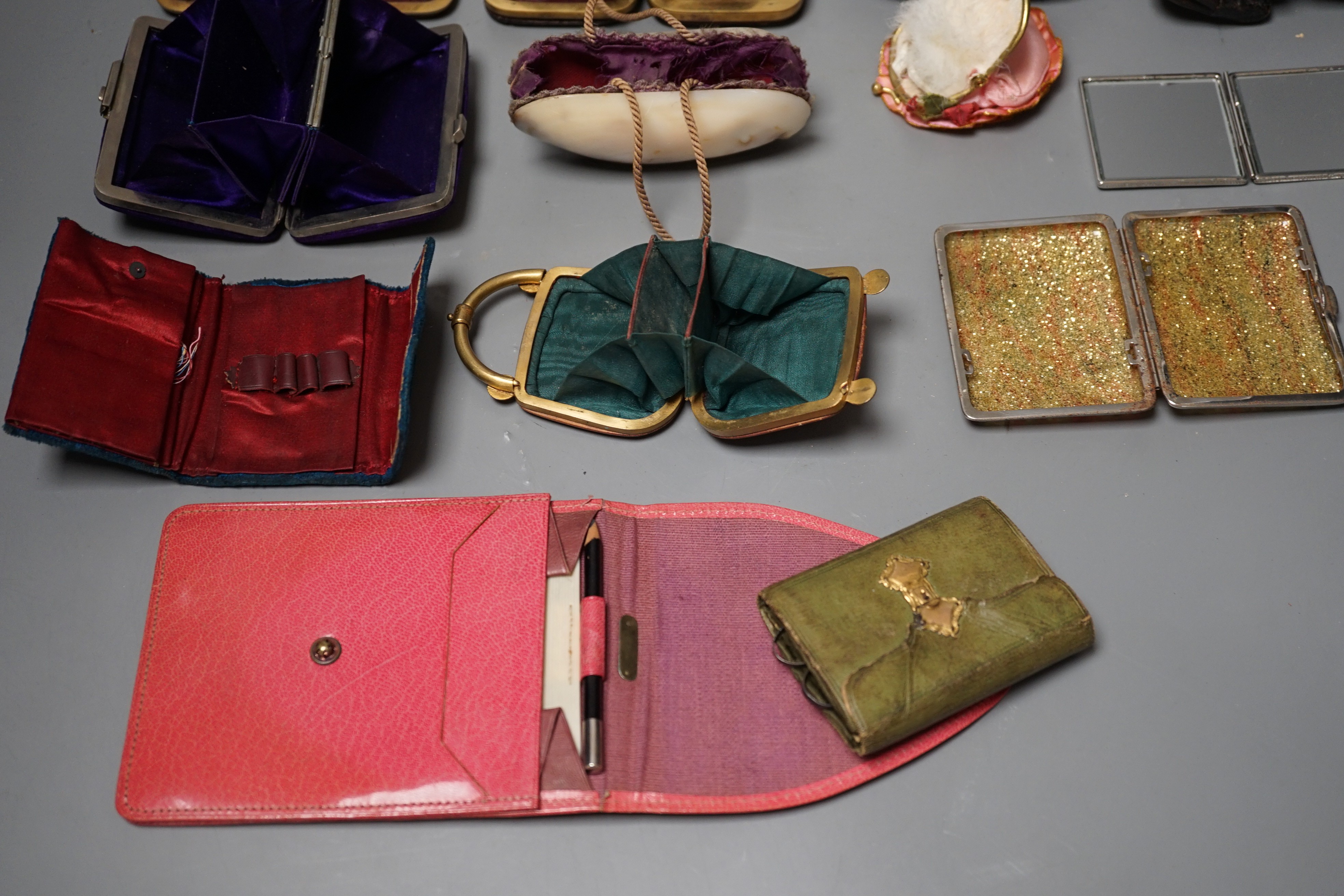 A collection of thirteen 19th century and 20th century ladies purses, one Morocco leather, five other leather purses, a shell purse, velvet embroidered purse and five others